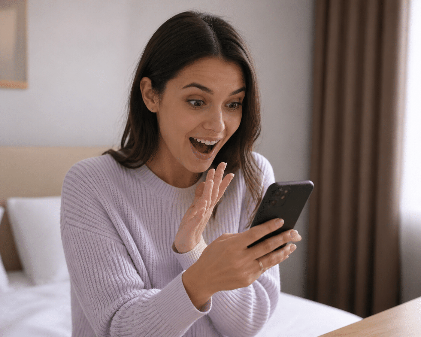 Guest opening email on phone before arrival showing anticipation and excitement