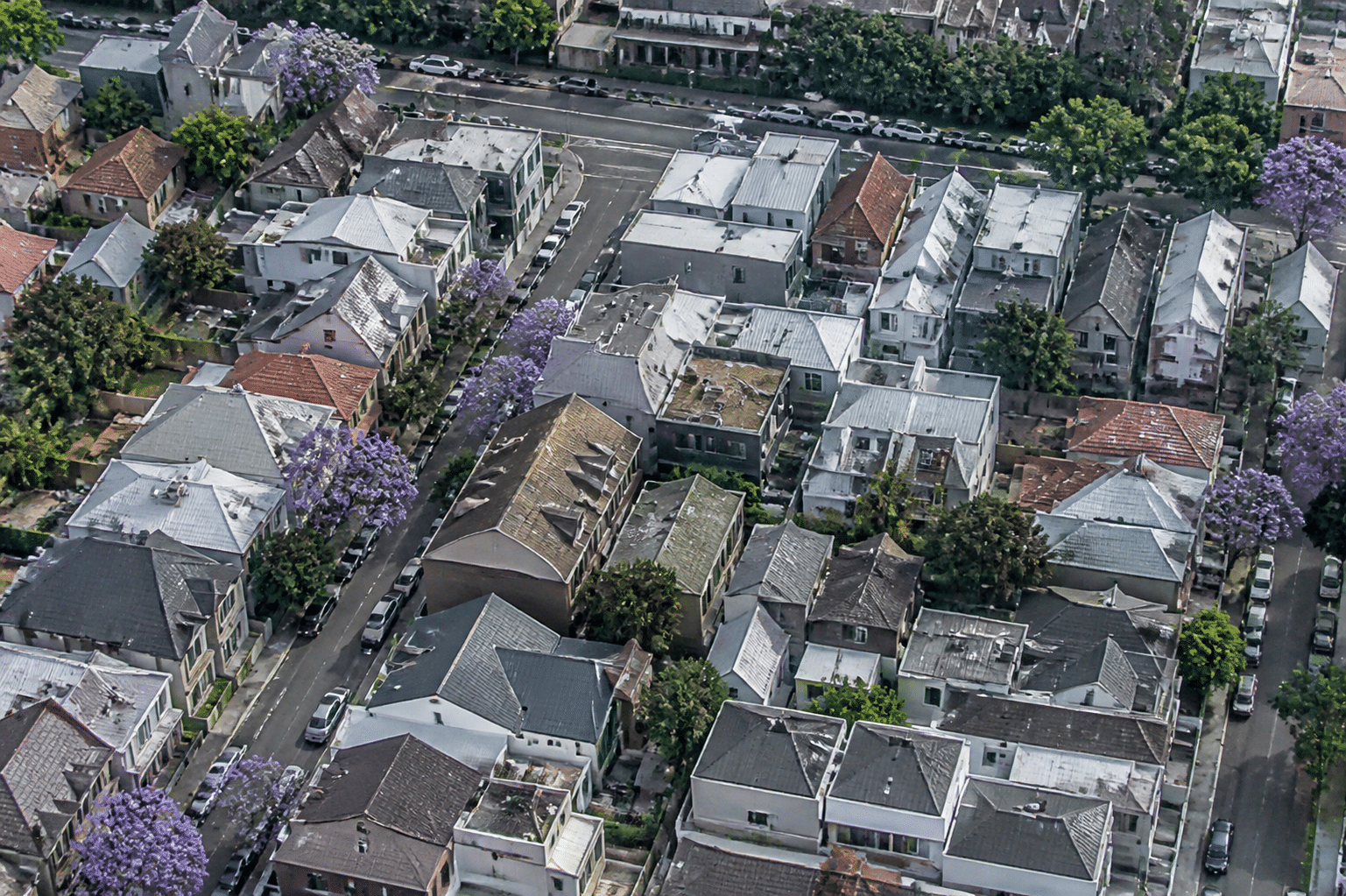 Aerial view of densely packed residential neighborhood showing market saturation and competition